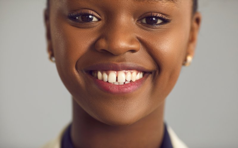 woman with gap between upper front two teeth 